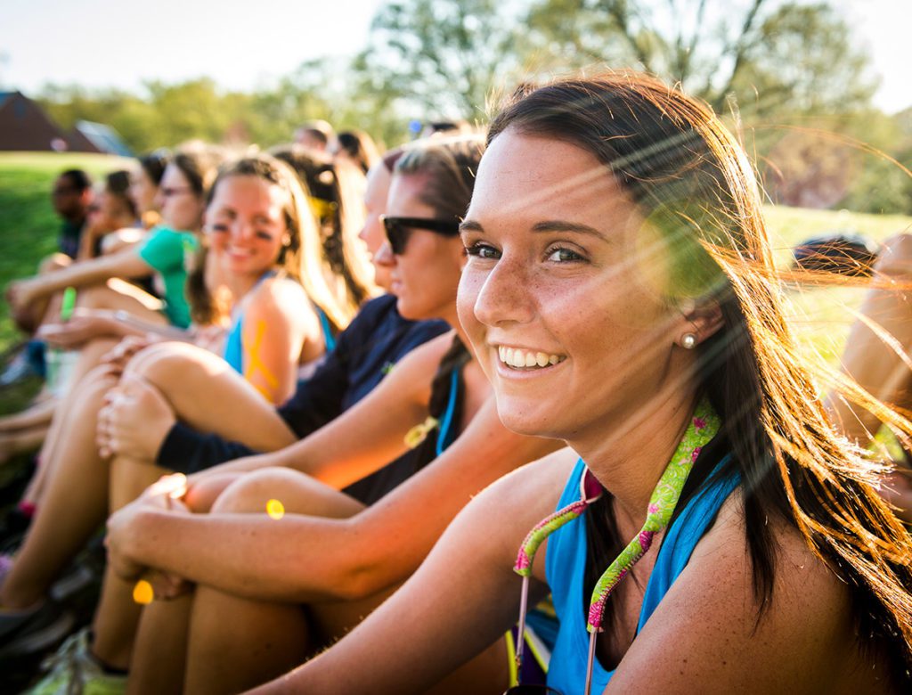 Students relaxing outdoors at a college campus in Greensboro, NC