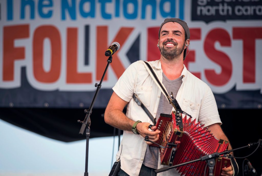 Musician performing with an accordion at the National Folk Festival in Greensboro, NC