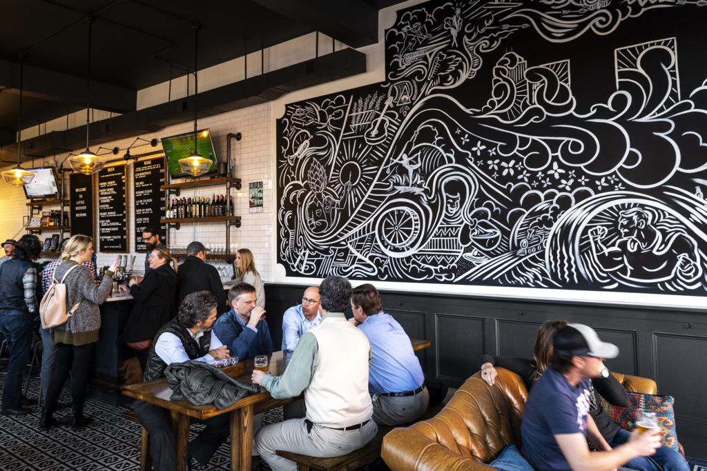 Patrons inside Little Brother Brewing in Greensboro, NC